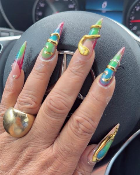 Long stiletto nails with colorful 3D swirl nail art from 88 Nails in Lewisville